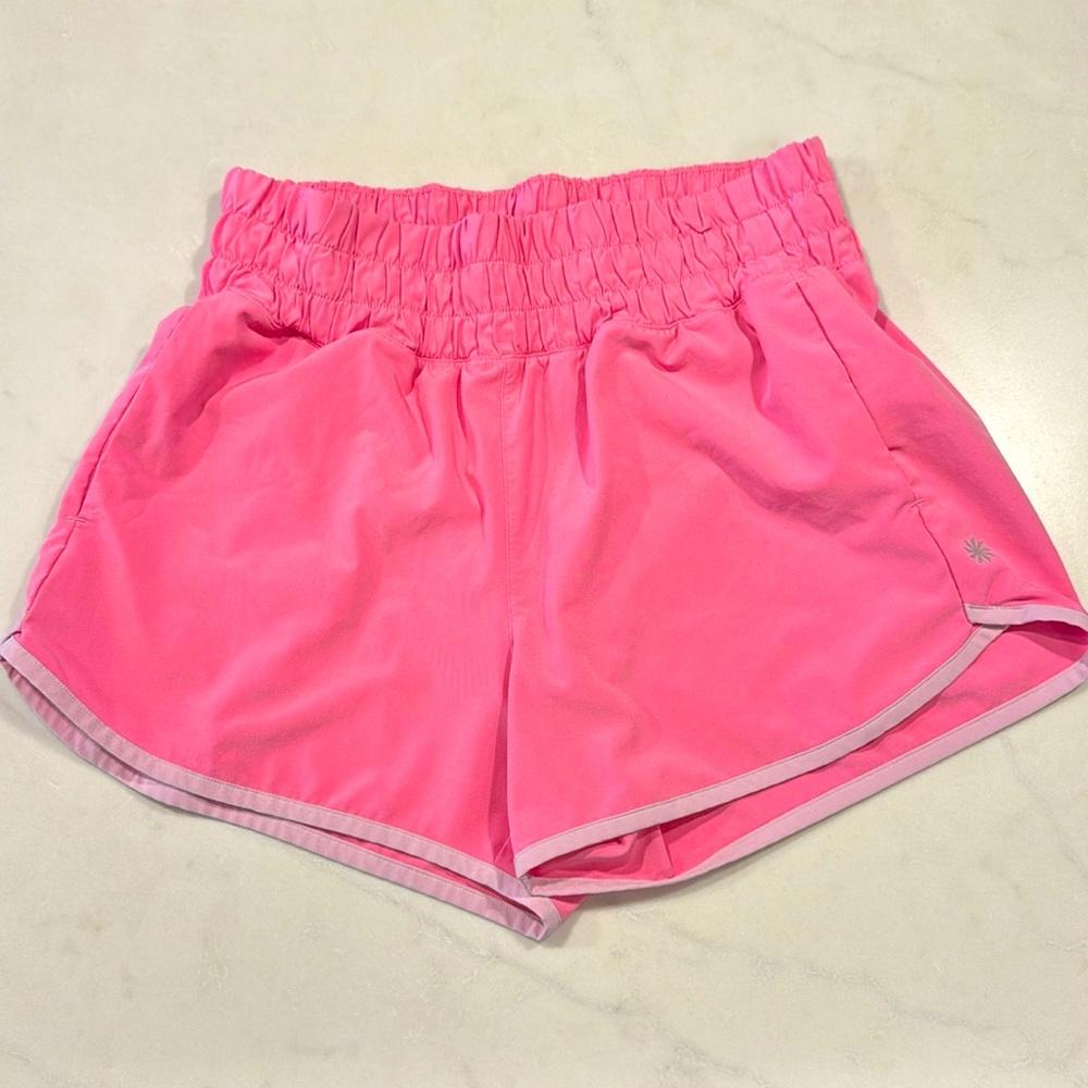 Athleta Girl Run Free 2.5” pink shorts, size 14 with pockets